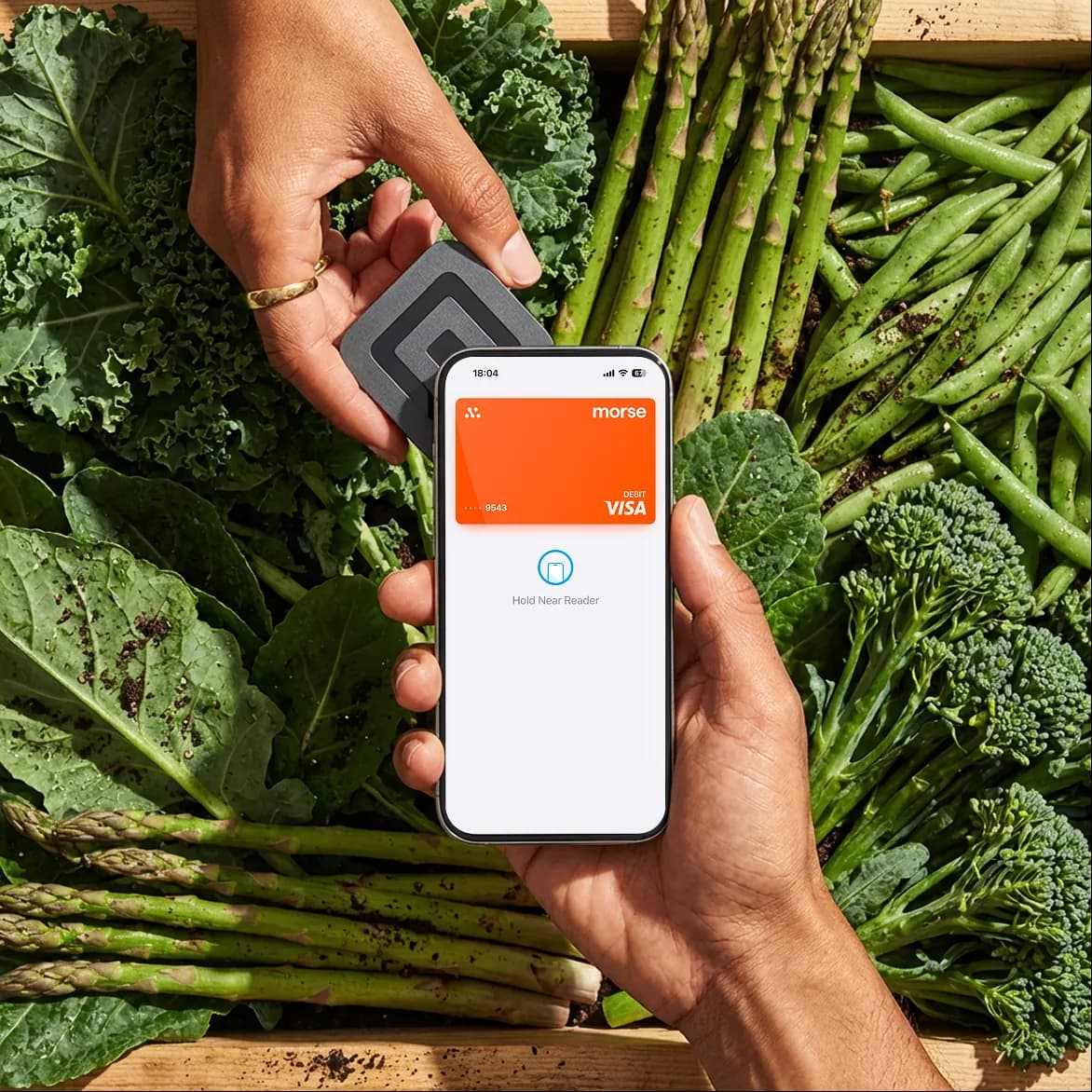 Paying by phone at a fresh-produce market stall