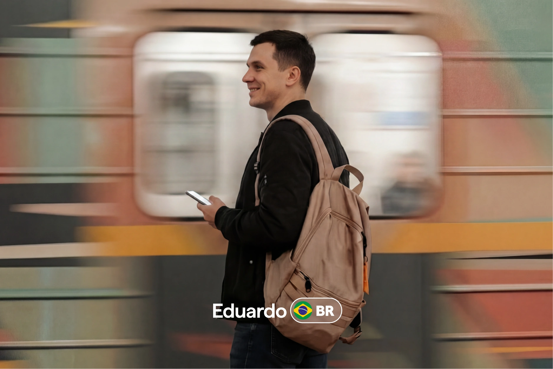 Eduardo from Brazil checking his phone with a blurred subway train rushing past