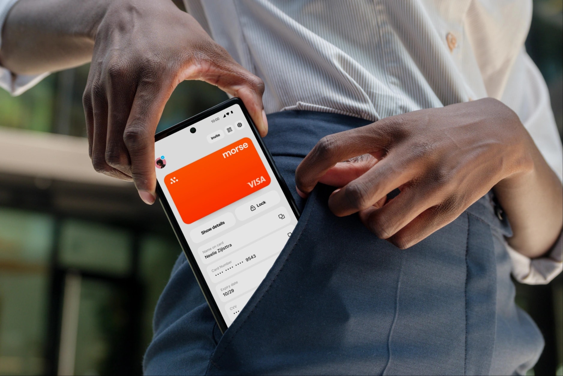 Morse Card on a phone being slipped into a pocket